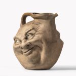 Martinware double-sided stoneware pottery ‘face’ jug close up detail