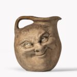 A Martinware double-sided stoneware pottery ‘face’ jug