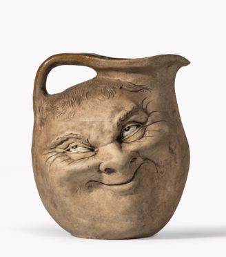 A Martinware double-sided stoneware pottery ‘face’ jug