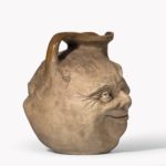 Martinware double-sided stoneware pottery ‘face’ jug handle