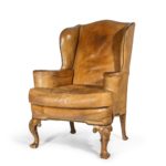 pair of walnut wing armchairs in the Queen Anne style