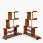 A pair of asymmetrical Art Deco walnut shelf