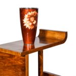 A pair of asymmetrical Art Deco walnut shelves vase