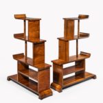 A pair of asymmetrical Art Deco walnut shelf rear