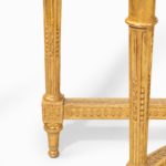 A Louis Philippe giltwood demi-lune console table leg details