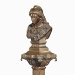 A bronze column depicting ‘La Colonne de la Republique’ dated 1889 bust details