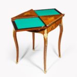 A kingwood marquetry envelope card table open