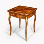 A kingwood marquetry envelope card table