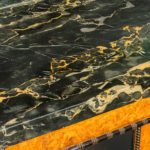 A late Regency portoro marble topped amboyna side cabinet top marble close up