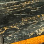 A late Regency portoro marble topped amboyna side cabinet top marble details