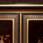 An exquisite exhibition quality side cabinet by Giroux, with central doors bearing lacquer panels showing the four seasons.