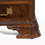 An unusual pair of early 20th century walnut serpentine commodes close up foot