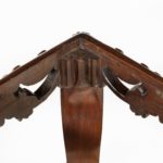 A pair of Victorian carved mahogany stool corner