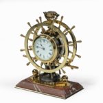 A Victorian brass novelty clock by Elkington & Co side
