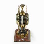 A Victorian brass novelty clock by Elkington & Co side view