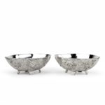 A pair of Meiji period solid silver bowls