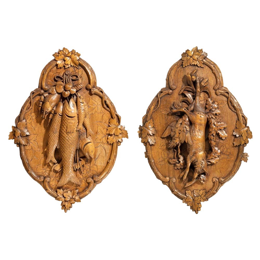 A pair of ‘Black Forest’ walnut game plaques attributed to Johann Flück