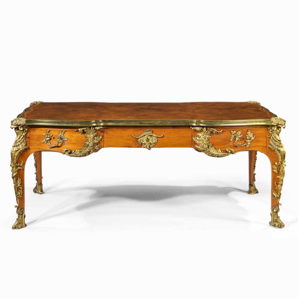 An outstanding Louis XV-style mahogany bureau plat after a model by Jacques B. Dubois, from the estate of Phyllis McGuire