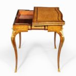 A Napoleon III parquetry card table by Sormani side