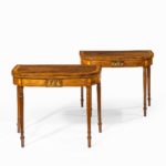 A pair of George III rosewood Sheraton period card tables front