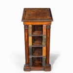 A freestanding mahogany open bookcase attributed to Gillows side