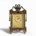 A bronze easel clock by Martin Company main