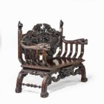 An ornamental Meiji period two-seater hall bench