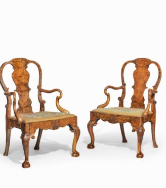 A pair of George II style walnut open arm chairs, possibly by Charles Tozer