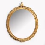 A Victorian gilt mirror, of oval form with a giltwood and gesso rope twist frame centred on a bust of Prince Albert. ‘Turner. Carver & Gilder Composition Ornament, Looking Glass & Picture Frame