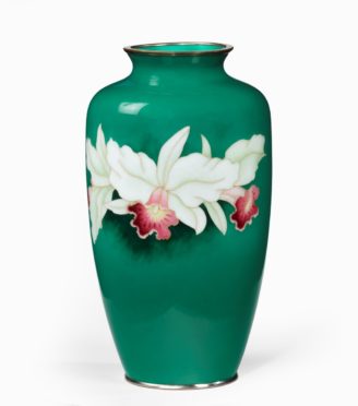 A Showa period tall deep green ground cloisonne vase, with three white and pink orchids, silvered metal mounts, Japanese, mid 20th century