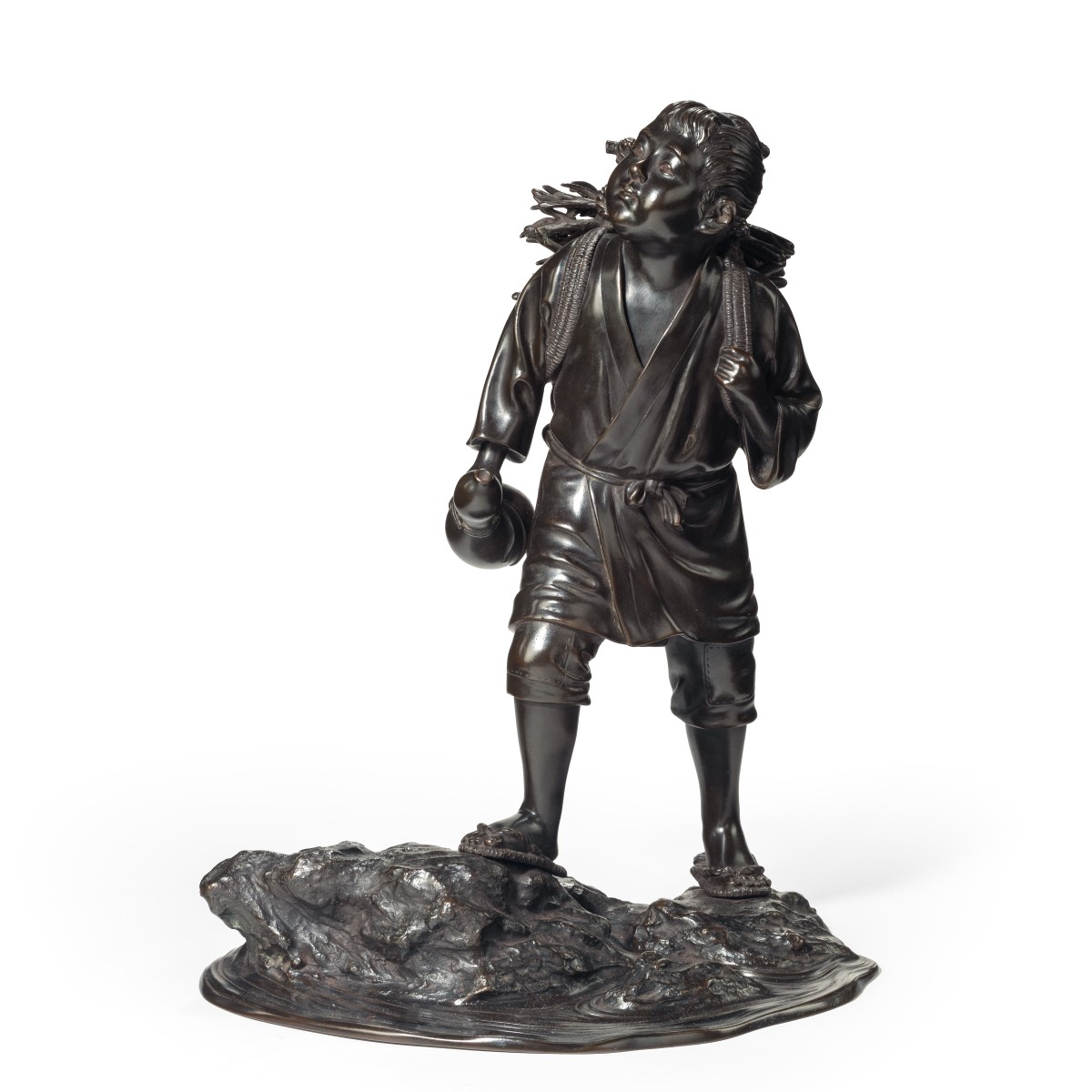 A Meiji period bronze of a boy carrying twigs,