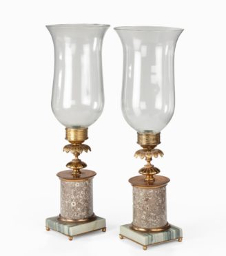 A pair of decorative storm lamps,
