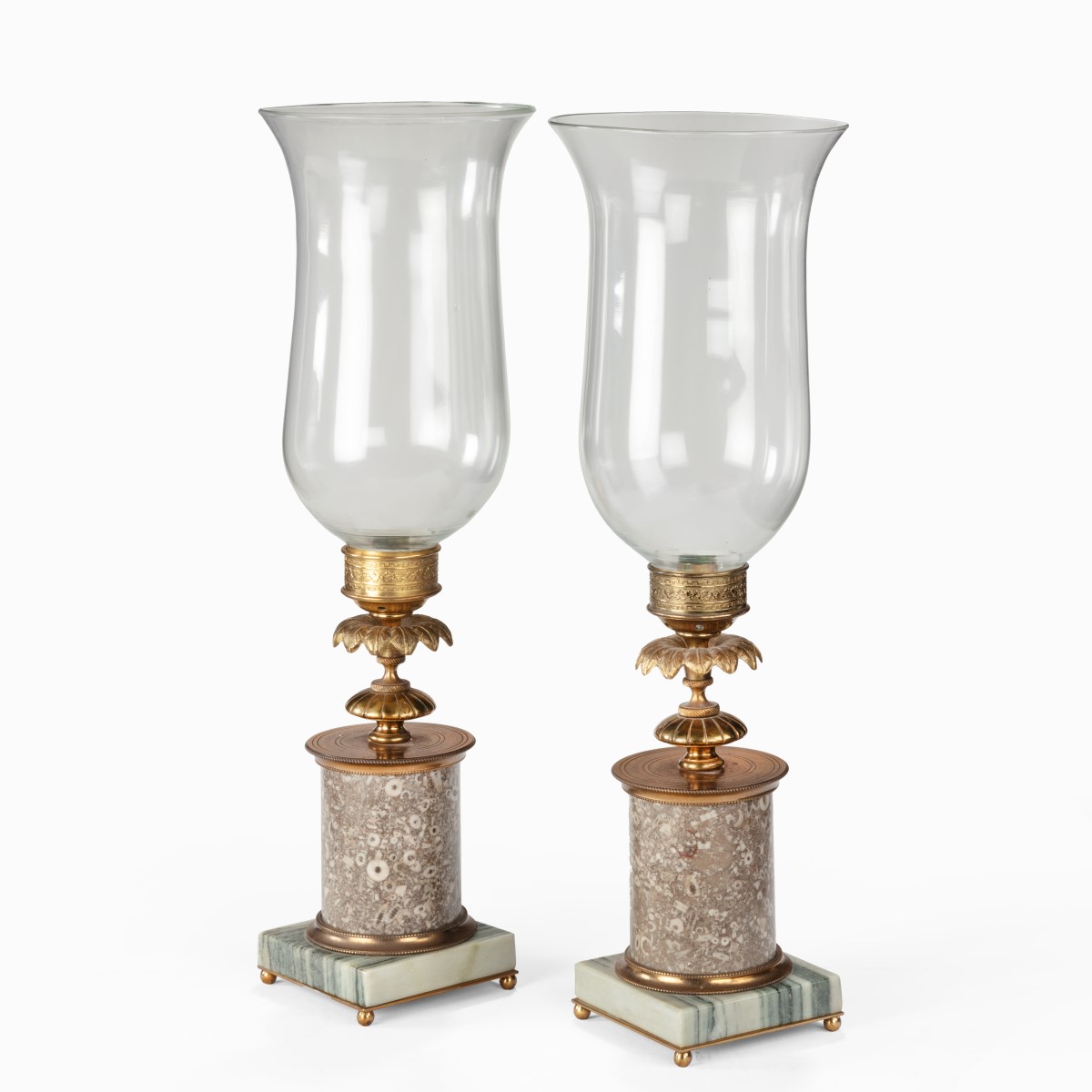 A pair of decorative storm lamps,