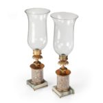 A pair of decorative storm lamps