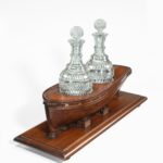 A rare late Georgian mahogany novelty decanter stand
