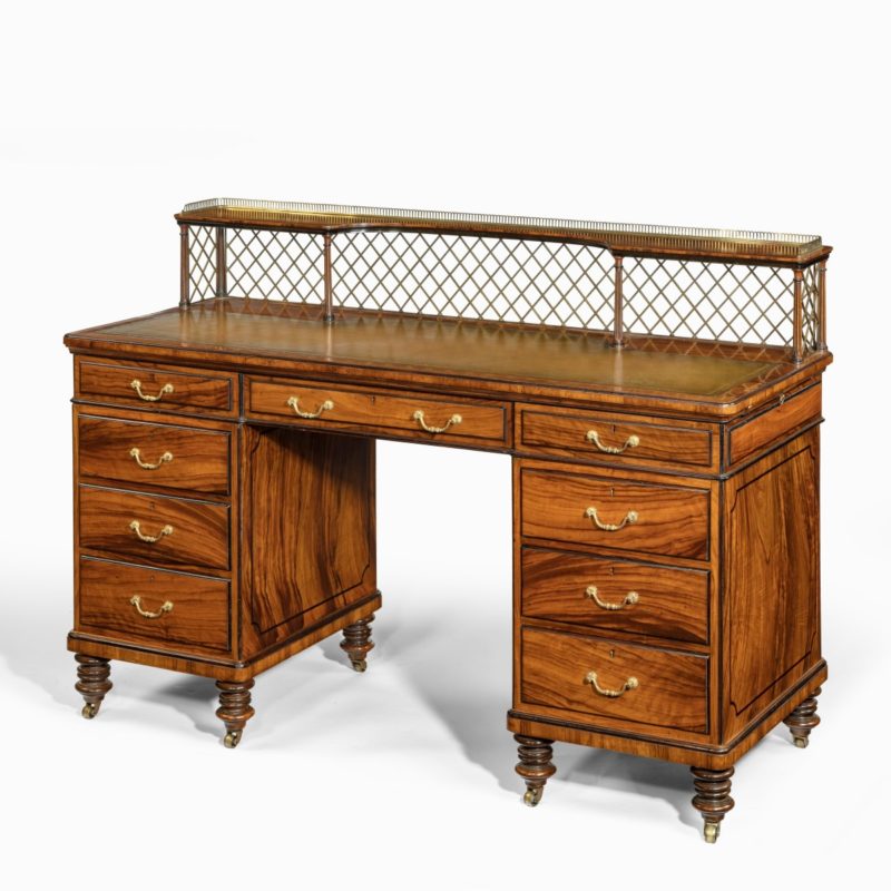 An olivewood pedestal desk attributed to Wright and Mansfield