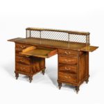 An olivewood pedestal desk attributed to Wright and Mansfield open