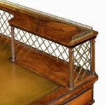 An olivewood pedestal desk attributed to Wright and Mansfield top details