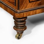 An olivewood pedestal desk attributed to Wright and Mansfield feet details