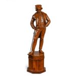 A Victorian carved walnut figure of a fashionable gentleman back