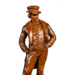 A Victorian carved walnut figure of a fashionable gentleman detailing