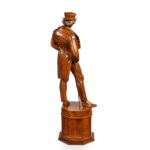 A Victorian carved walnut figure of a fashionable gentleman back details