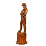 Victorian carved walnut figure of a fashionable gentleman side