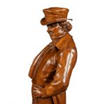 Victorian carved walnut figure of a fashionable gentleman side profile