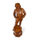 A Victorian carved walnut figure of a fashionable gentleman top