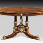 A centre table attributed to Holland and Sons related to a table in Clarence House