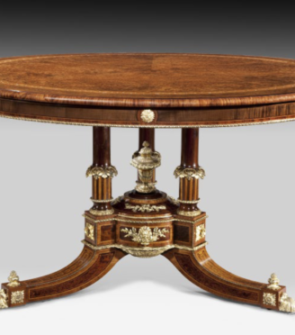 A centre table attributed to Holland and Sons related to a table in Clarence House