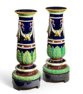 A pair of Victorian majolica jardinière stands by Minton