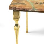 A Continental brass marble-topped coffee table leg detail