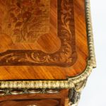 A French kingwood marquetery commode top corner detailing